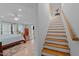 Primary bedroom with wooden staircase at 802 N Franklin St, Wake Forest, NC 27587