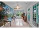 Open bonus room featuring a nature mural, ceiling fan, and double doors at 802 N Franklin St, Wake Forest, NC 27587