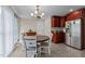 Eat-in kitchen with dining table and updated appliances offers a casual dining experience at 802 N Franklin St, Wake Forest, NC 27587