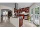Bright, updated kitchen with center island and stainless appliances offers a functional layout for cooking at 802 N Franklin St, Wake Forest, NC 27587