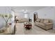 Spacious living room with tile flooring and neutral decor, perfect for relaxing and entertaining guests at 802 N Franklin St, Wake Forest, NC 27587