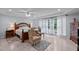 Spacious bedroom with natural light, tray ceiling, and an elegant sitting area at 802 N Franklin St, Wake Forest, NC 27587