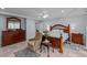 Spacious bedroom with a trey ceiling, a ceiling fan, and light blue walls at 802 N Franklin St, Wake Forest, NC 27587