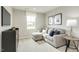 Bedroom with a comfy sofa, window, and stylish decor, ideal for relaxation and leisure at 1585 Ivy Meadow Ln, Zebulon, NC 27597