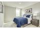Cozy bedroom with blue accents, plush carpeting, and playful artwork at 1585 Ivy Meadow Ln, Zebulon, NC 27597