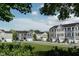 New row of modern townhomes with complementary colors and well-kept lawns at 1585 Ivy Meadow Ln, Zebulon, NC 27597