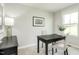 Office space with neutral walls, a dark wood desk, a black cabinet, and a bright window at 1585 Ivy Meadow Ln, Zebulon, NC 27597