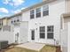 Exterior view of the home featuring a white siding and a small patio in the backyard at 18 Clementine Street St # 207, Angier, NC 27501