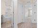 Bathroom featuring a shower-tub combo, grey vanity, and wood-look flooring at 18 Clementine Street St # 207, Angier, NC 27501