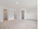 Spacious bedroom with neutral carpet and multiple closets, offering ample storage space at 18 Clementine Street St # 207, Angier, NC 27501