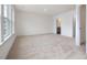 Bright bedroom features neutral carpet, multiple windows, and an ensuite bathroom at 18 Clementine Street St # 207, Angier, NC 27501