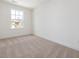 Cozy bedroom with a large window, providing plenty of natural light at 18 Clementine Street St # 207, Angier, NC 27501