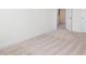 Bedroom view showcasing neutral carpet and trim against a white wall at 18 Clementine Street St # 207, Angier, NC 27501