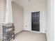 Inviting front porch featuring stone accents, a stylish front door, and a cozy entryway to the home at 18 Clementine Street St # 207, Angier, NC 27501