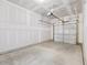 Garage interior with concrete floor and white walls at 18 Clementine Street St # 207, Angier, NC 27501