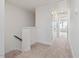 Hallway with carpet and white trim at 18 Clementine Street St # 207, Angier, NC 27501