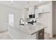 Kitchen features island, quartz countertops, stainless steel appliances, and white cabinetry at 18 Clementine Street St # 207, Angier, NC 27501