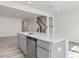 Kitchen island with stainless sink, quartz countertops, and stainless steel appliances at 18 Clementine Street St # 207, Angier, NC 27501