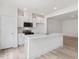 Bright kitchen with island, stainless appliances, and white cabinetry at 18 Clementine Street St # 207, Angier, NC 27501