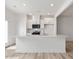 Well-lit kitchen featuring a large island, stainless steel appliances, and white cabinetry at 18 Clementine Street St # 207, Angier, NC 27501
