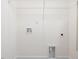 Utility room with white walls, shelf and gray trim provides a clean and functional space at 18 Clementine Street St # 207, Angier, NC 27501