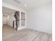 Open-concept living room with wood floors and view of staircase at 18 Clementine Street St # 207, Angier, NC 27501