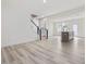 Open-concept living area with stairs, and kitchen island with stainless steel sink at 18 Clementine Street St # 207, Angier, NC 27501