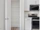 Walk-in pantry with wire shelving next to kitchen with stainless appliances at 18 Clementine Street St # 207, Angier, NC 27501