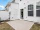 Back patio features a white exterior and doorway to the home's interior at 18 Clementine Street St # 207, Angier, NC 27501