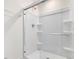 Bright and modern shower with glass doors and built-in shelving at 18 Clementine Street St # 207, Angier, NC 27501