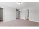 Large bedroom with ensuite bathroom and walk-in closet with multiple open doorways at 2034 Fishamble St # 30, Fuquay Varina, NC 27526