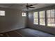Bright primary bedroom featuring large windows, a ceiling fan, and ample natural light at 846 Cabin Creek Crk, Pittsboro, NC 27312