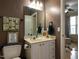 Well-appointed bathroom featuring a vanity with sleek fixtures and a decorative framed saying at 1001 Hillsborough St # 304, Raleigh, NC 27603
