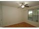 Clean, light filled bedroom with wood floors and a ceiling fan at 1001 Hillsborough St # 304, Raleigh, NC 27603