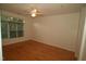 Bedroom with wood floors, neutral wall paint, a ceiling fan, and natural light at 1001 Hillsborough St # 304, Raleigh, NC 27603