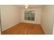 Bright bedroom with a window and wood floors at 1001 Hillsborough St # 304, Raleigh, NC 27603
