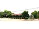 Street view of a commercial building exterior with greenery and outdoor seating at 1001 Hillsborough St # 304, Raleigh, NC 27603