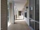 Exterior hallway showing architecture of the building with siding and windows on either side at 1001 Hillsborough St # 304, Raleigh, NC 27603