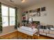 Bright home office with large window, shelving, and stylish desk setup at 1001 Hillsborough St # 304, Raleigh, NC 27603