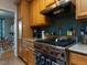 Well-equipped kitchen with stainless steel range and oak cabinetry at 1001 Hillsborough St # 304, Raleigh, NC 27603