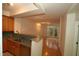 Open living space with wood floors, natural light and sight lines to the kitchen at 1001 Hillsborough St # 304, Raleigh, NC 27603