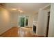 Bright living room with hardwood floors, fireplace, and access to private balcony at 1001 Hillsborough St # 304, Raleigh, NC 27603