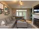 Comfortable living room offering a large sectional sofa, natural light, and a decorative fireplace at 1001 Hillsborough St # 304, Raleigh, NC 27603