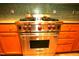 Premium Wolf oven with stainless steel finish, cooktop, and custom tile backsplash at 1001 Hillsborough St # 304, Raleigh, NC 27603