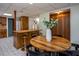 Basement featuring a wooden bar, a dining table, and retro tile flooring at 3615 Octavia St, Raleigh, NC 27606