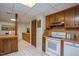 Classic basement kitchen with wood cabinets and retro-style appliances at 3615 Octavia St, Raleigh, NC 27606