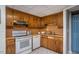 Traditional basement kitchen featuring wood cabinetry and vintage-style appliances at 3615 Octavia St, Raleigh, NC 27606