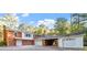 View of the home's garages and rear exterior at 3615 Octavia St, Raleigh, NC 27606