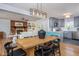 Open concept kitchen with stainless steel appliances, grey cabinetry, and breakfast bar at 3615 Octavia St, Raleigh, NC 27606