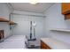 Practical laundry room with washer, dryer, and storage shelving at 3615 Octavia St, Raleigh, NC 27606